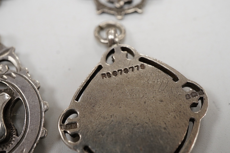 Five assorted early 20th century silver medals, including enamelled 'Luton District Football League, 1910/11', diameter 28mm.